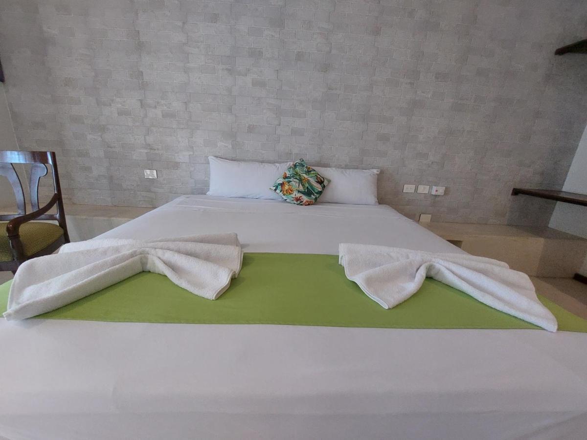 Hotel Mayari Holbox 外观 照片 A bed with a duvet cover